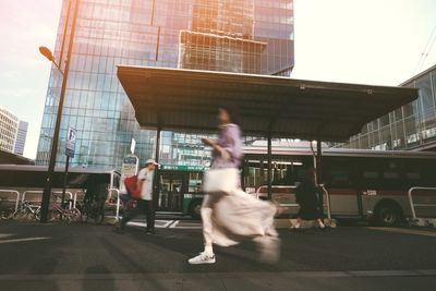 People walking on road in city