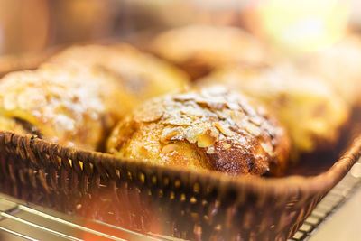 French almond chocolate croissant in bamboo woven basket