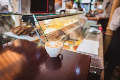 Coffee cup on table at restaurant