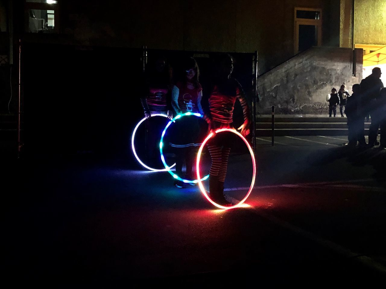 LIGHT PAINTING OF MAN IN ILLUMINATED LIGHTS