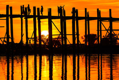 Magnificent sunset behind the u bein bridge - the longest teak bridge in the world, myanmar