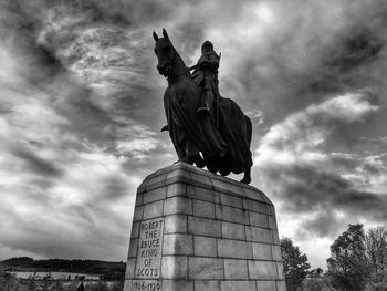 Low angle view of statue against sky