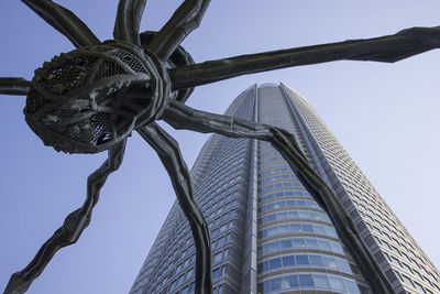 Low angle view of sculpture against building