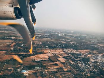 Cropped image of airplane flying in sky