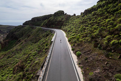 High angle view of road by mountain against sky