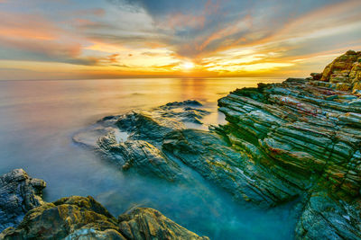 Scenic view of sea against sky during sunset