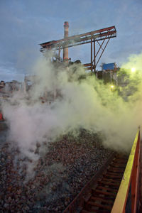 Smoke over gravels at altay koks factory