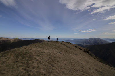 Scenic view of mountains against cloudy sky