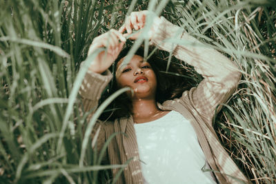 Portrait of woman in tall grass