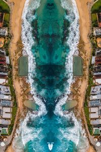 High angle view of sea by buildings