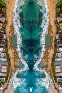 High angle view of sea by buildings