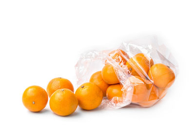 Close-up of oranges against white background