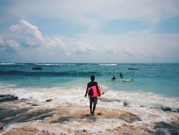 Scenic view of sea against cloudy sky