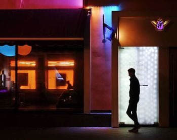 Blurred motion of woman at night