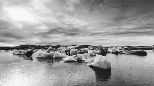 Panoramic view of frozen sea against sky