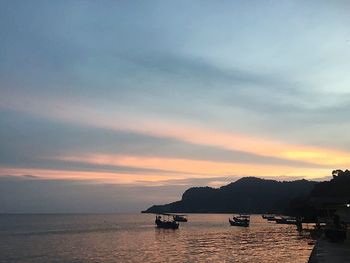 Scenic view of sea against dramatic sky