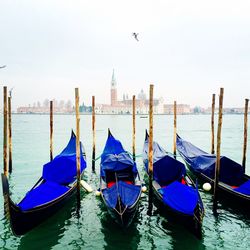 Boats moored in canal against st marks square