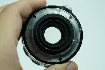 Close-up of man photographing camera