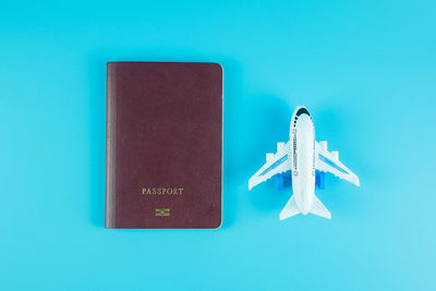 Close-up of airplane against blue background