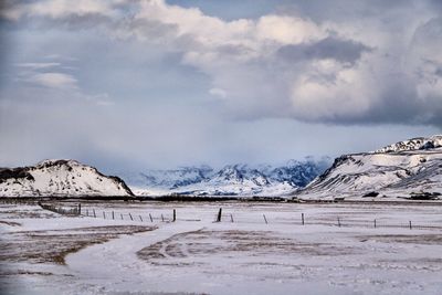 Scenic view of snowcapped mountains against sky