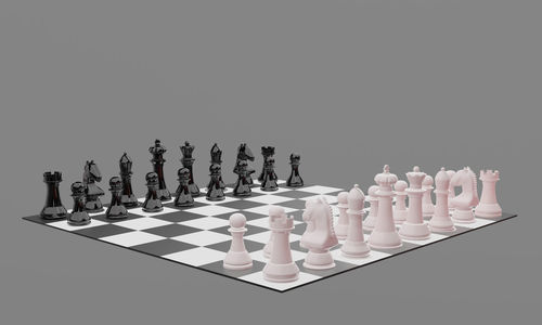Row of chess pieces against white background