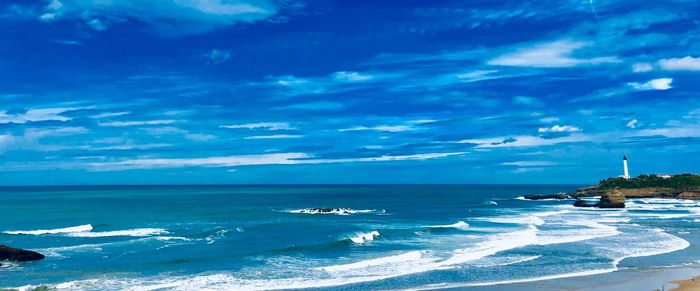 Scenic view of sea against blue sky