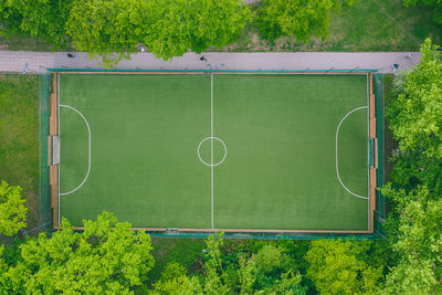 Aerial view of soccer field amidst trees