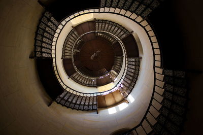 Low angle view of spiral staircase in building