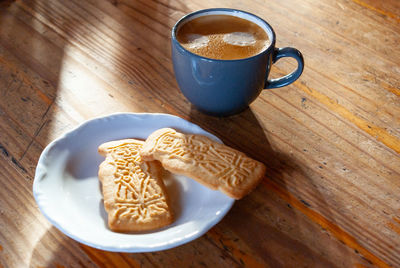 High angle view of coffee cup on table