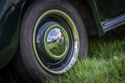 Close-up of vintage car on field