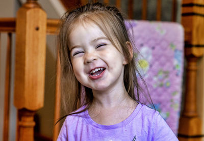 A cute two-year old puts on her funny face