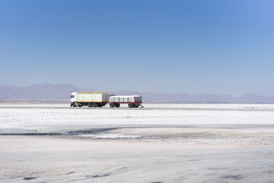 Scenic view of beach against clear sky