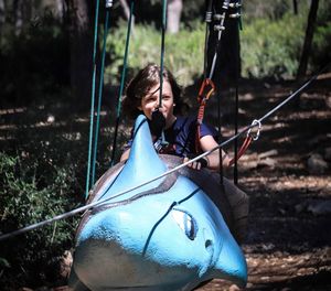 Portrait of girl sitting on slide