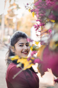 Portrait of a smiling young woman outdoors
