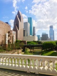 Modern buildings in city against sky