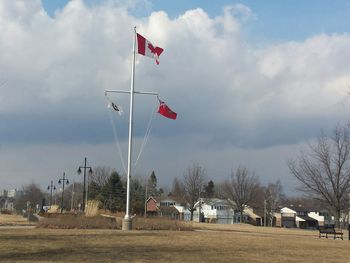 Flag on field against sky