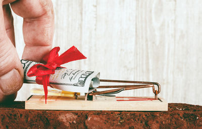Low section of woman holding red umbrella