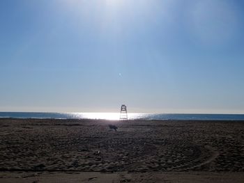 Scenic view of beach against clear sky