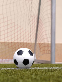 Close-up of soccer ball on field