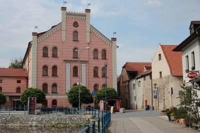 Street amidst buildings against sky