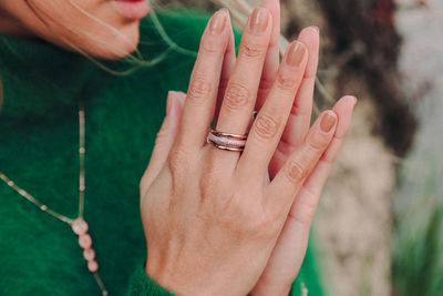 Midsection of woman hand on finger