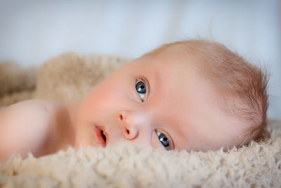 Close-up portrait of cute baby girl at home