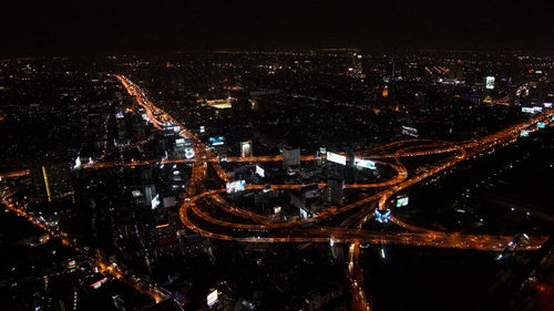 Aerial view of illuminated city at night