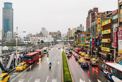 High angle view of city street and buildings against sky