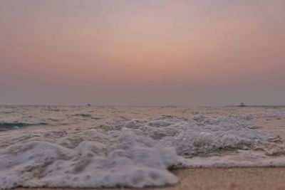 Scenic view of beach against sky during sunset