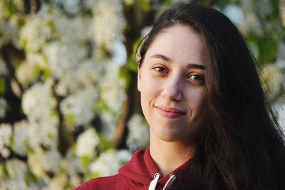 Close-up portrait of smiling young woman