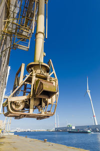 Low angle view of ship against clear blue sky