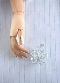 Low section of woman holding trophy