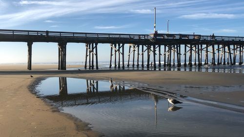 Pier over sea against sky