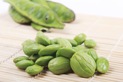 High angle view of green chili peppers on table